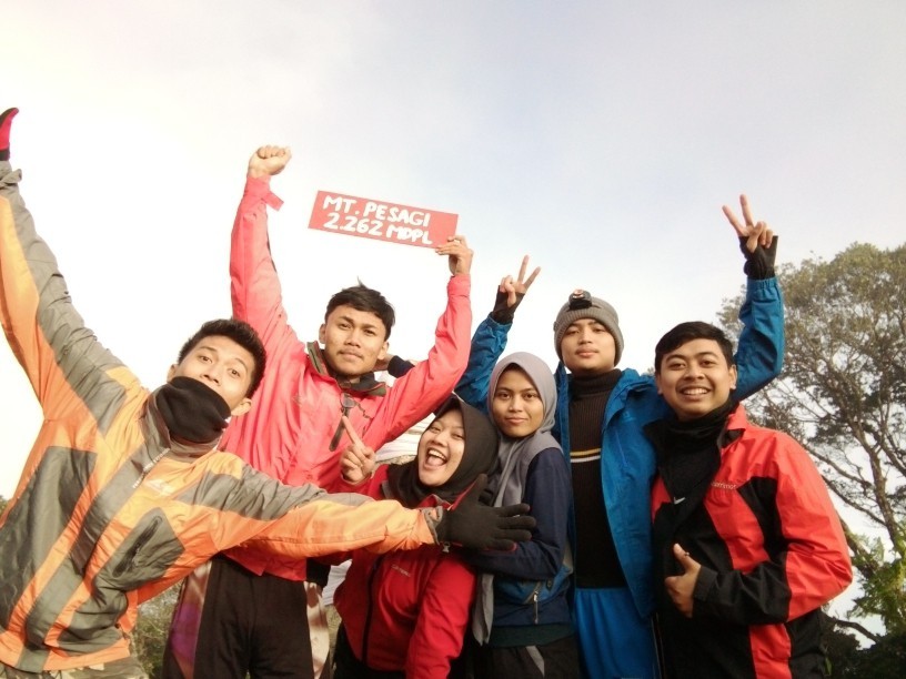 Hadi reaching the highest mountain in Lampung Province, Indonesia in 2021